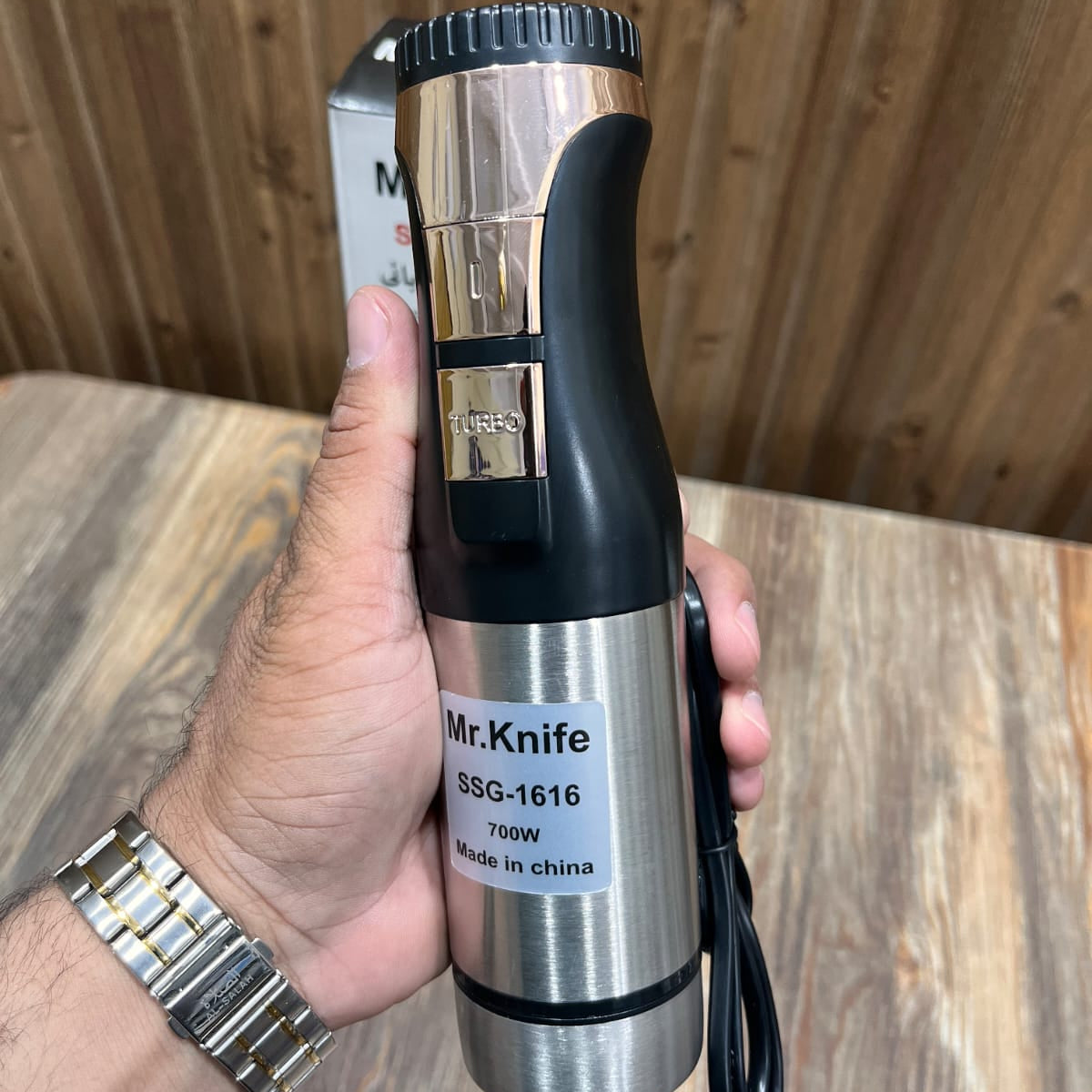 Mr.Knife 700W hand blender with a stainless steel body and 4-blade design.