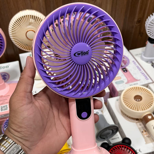 Wego portable rechargeable mini cooling fan featuring a digital display, five-speed settings, and a pink handle with a purple cage