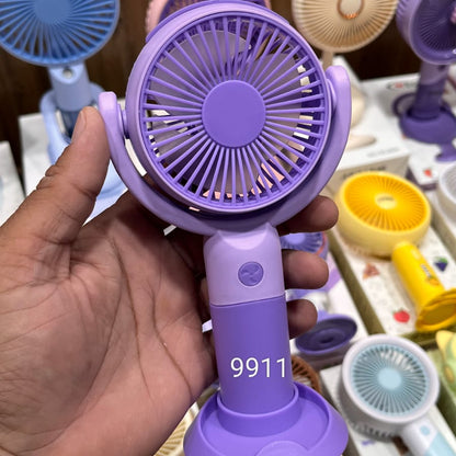 Portable Purple Handheld Mini Fan With a Desk Stand and Button Controls