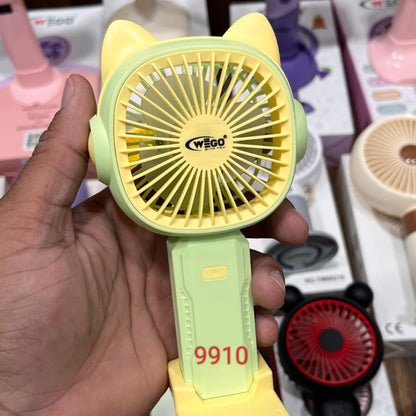 WEGO rechargeable cartoon handheld fan with a yellow cat-eared fan head and a light green handle..
