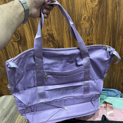 Hong Fu branded lilac purple foldable travel bag made from lightweight waterproof fabric.